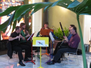 Zaptet Woodwind Quintet Performing Under Plant Frond at Stonestown Galleria in San Francisco